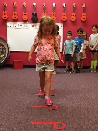 Kid playing bass boomers