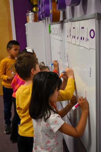 Kids learning music notes