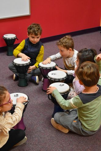 Kids jumping in a musical bounce house