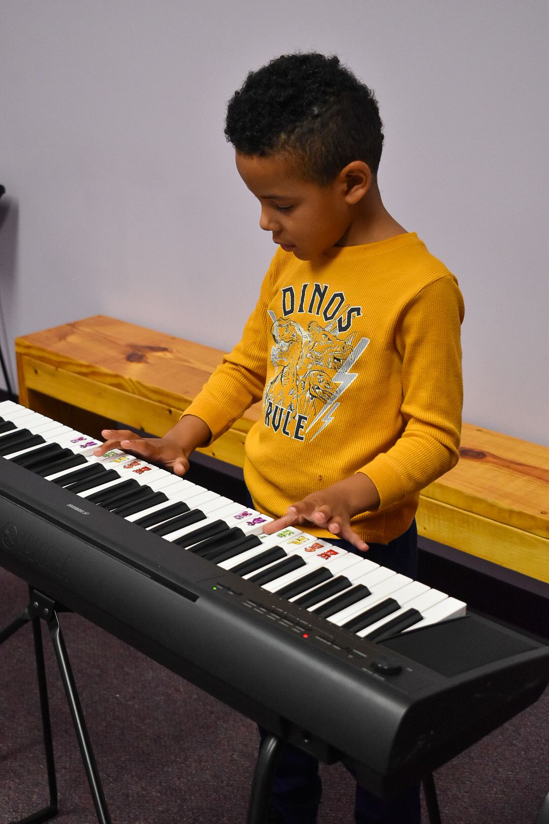 kid playing piano